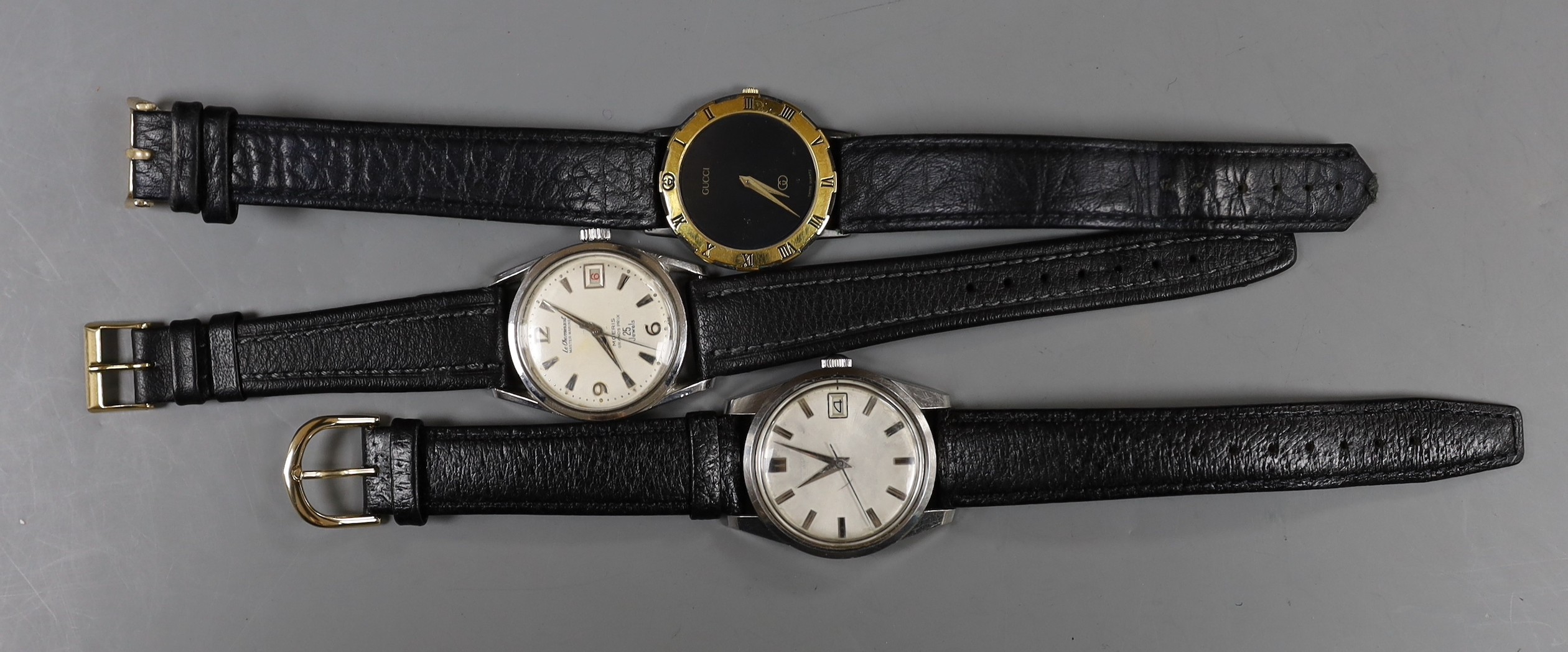 A gentleman's steel Le Chamois wrist watch, a gentleman's gold plated Gucci wrist watch and a gentleman's steel Seahorse wrist watch.